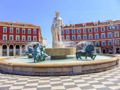a fountain with a statue in front of a building at Apartment Hérold-2 by Interhome in Nice