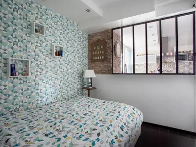 a bedroom with a bed and a large window at Apartment Cros de Cagnes-1 by Interhome in Cagnes-sur-Mer