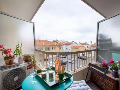 a balcony with a table and a view of a street at Apartment Cros de Cagnes-1 by Interhome in Cagnes-sur-Mer
