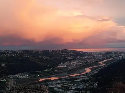 an aerial view of a city and a river at 3 pièces dans le ciel in Gattières