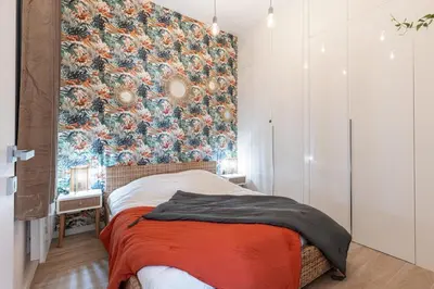 a bedroom with a floral wallpaper on the wall at MY CASA - GESU - 2 bedrooms in Old Town - Gesu Square in Nice