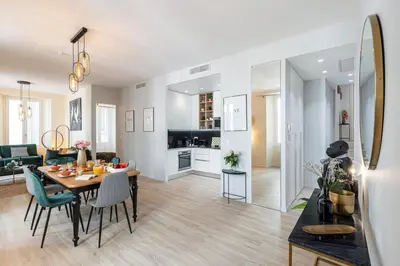 a living room and dining room with a table and chairs at MY CASA - GESU - 2 bedrooms in Old Town - Gesu Square in Nice