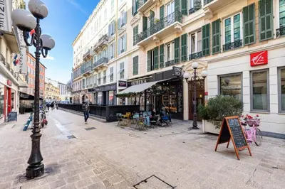 a city street with buildings and a street light at MY CASA - DEROULEDE - Superb Studio Suite w AC Downtown in Nice