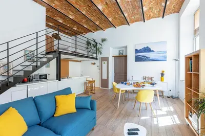 a living room with a blue couch and a table at MY CASA - GUBERNATIS - Beautiful Duplex with terrace in Nice
