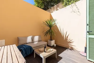 a living room with a couch and a table at MY CASA - GUBERNATIS - Beautiful Duplex with terrace in Nice