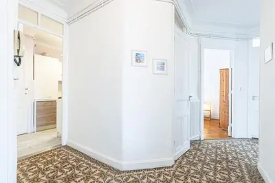 an empty hallway with white walls and a carpet at MY CASA - JOFFRE 38 - Spacious one bedroom apartment in Nice