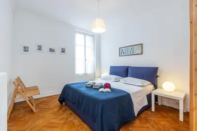 a bedroom with a blue bed with a blue blanket at MY CASA - JOFFRE 38 - Spacious one bedroom apartment in Nice