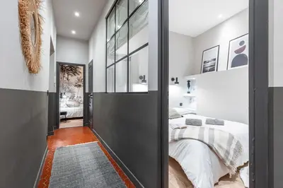 a bedroom with a bed and a large glass door at MY CASA - LA CROIX - Old Town Modern apartment - 2 bedrooms in Nice