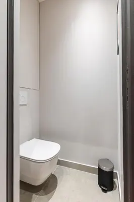 a bathroom with a white toilet and a stool at MY CASA - LA CROIX - Old Town Modern apartment - 2 bedrooms in Nice