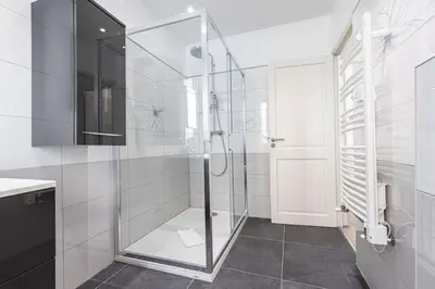 a bathroom with a shower with a glass door at MY CASA - PONCHETTES - Independent House Promenade Des Anglais in Nice