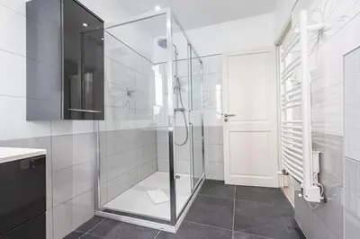 a bathroom with a shower with a glass door at MY CASA - PONCHETTES - Independent House Promenade Des Anglais in Nice