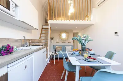 a kitchen and dining room with a table and chairs at MY CASA - PREFECTURE 15 - Old Town Duplex 2 double beds in Nice