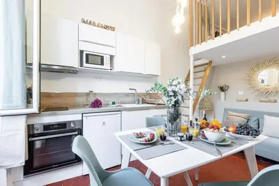 a kitchen with a table with fruit on it at MY CASA - PREFECTURE 15 - Old Town Duplex 2 double beds in Nice