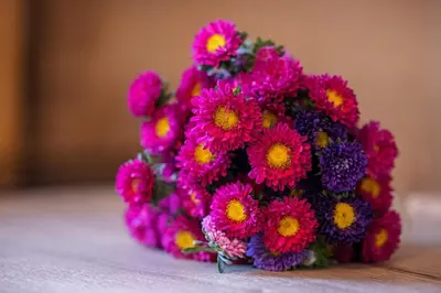 a bouquet of pink flowers sitting on a table at MY CASA - PREFECTURE 15 - Old Town Duplex 2 double beds in Nice