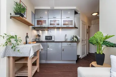 a kitchen with stainless steel cabinets and a counter at MY CASA - STALINGRAD 32 - Cosy Apartement close old Port in Nice