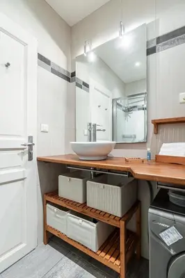 a bathroom with a counter with a sink and a mirror at MY CASA - STALINGRAD 32 - Cosy Apartement close old Port in Nice