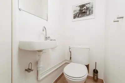 a white bathroom with a toilet and a sink at EXCEPTIONNEL 4 pieces vue panoramique baie des anges proche plage in Nice