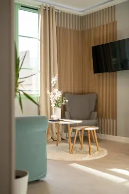 a living room with a coffee table and a couch at Modern Apartment - Promenade des Anglais in Nice in Nice