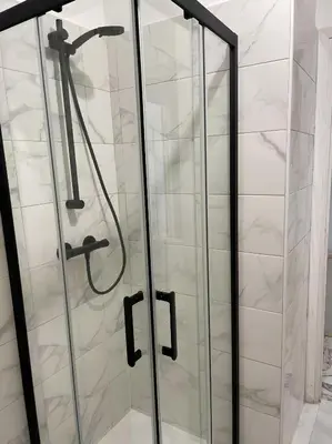 a shower with glass doors in a bathroom at Studio 50 m de la mer - Centre - Proche mer in Nice