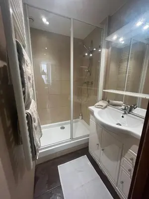 a bathroom with a tub and a sink and a shower at Vieux Nice 2 pièces Appartement MONACO in Nice