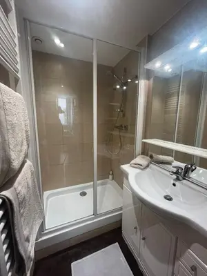 a bathroom with a shower and a sink and a tub at Vieux Nice 2 pièces Appartement MONACO in Nice