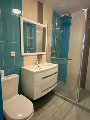 a bathroom with a toilet and a sink and a shower at Cagnes-sur-Mer, 50m de la mer, au calme in Cagnes-sur-Mer