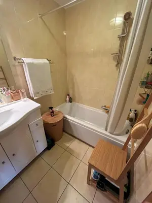 a bathroom with a bath tub and a sink at Chambre privée avec terrasse au port de Nice in Nice