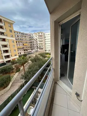 a balcony with a view of a building at Magnifique studio au bord de mer in Nice