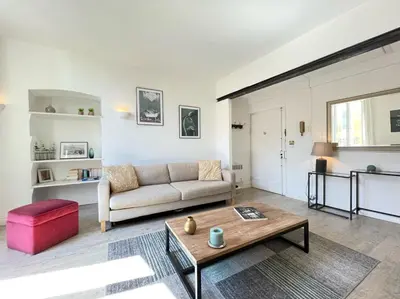 a living room with a couch and a coffee table at Nice Renting - BONAPARTE - Luxury Loft Trendy neighborhood - AC - fully equipped in Nice
