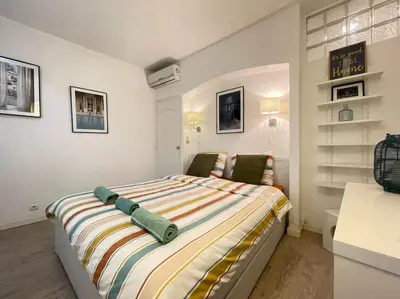 a bedroom with a large bed in a room at Nice Renting - BONAPARTE - Luxury Loft Trendy neighborhood - AC - fully equipped in Nice
