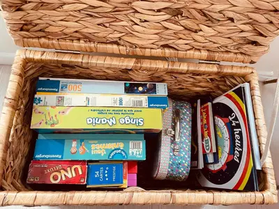 a wicker basket filled with books and magazines at Appartement Carré d’Or Nice in Nice