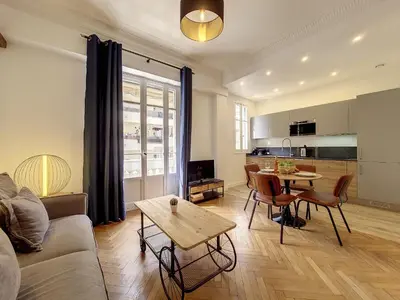 a living room with a couch and a table at Nestor&Jeeves - LE NICOIS - Central in Nice