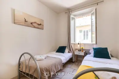 a bedroom with two beds and a window at Suite La bohème Five stars Holiday house in Nice