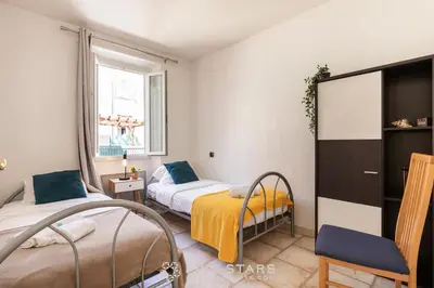 a bedroom with two beds and a window at Suite La bohème Five stars Holiday house in Nice