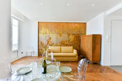 a living room with a couch and a table at Happyfew Palazzo del sol in Nice