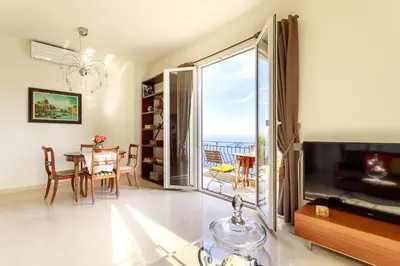 a living room with a view of the ocean at Sea View Apartment with Private Secure Parking 3 in Villefranche-sur-Mer