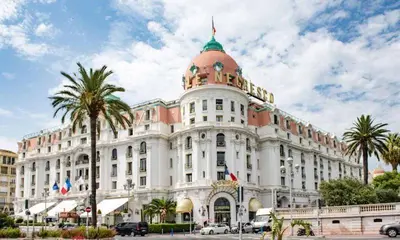 a large white building with a dome on top of it at Luxurious 2 bedrooms on Promenades des Anglais in Nice