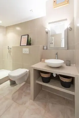 a bathroom with a sink and a toilet and a mirror at L5 2mins Walk to the Beach Heart of Old Town Nice in Nice