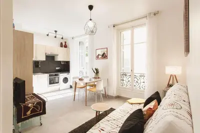 a person laying on a couch in a living room at L6 2Rooms 2mins walk from Negresco & Sea AC-Wifi in Nice