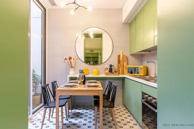 a kitchen with a table and chairs and a mirror at Nice Renting - BAVASTRO - Luxurious Loft - 2 BedRoom - AC - Balcony - Trendy Neighborhood in Nice