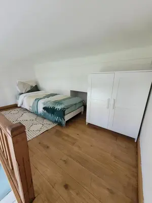 a bedroom with a bed and a white cabinet at 2 pièces promenade des anglais in Nice