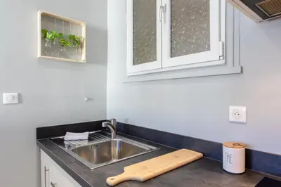 a kitchen counter with a sink and a window at L12 Port window 1Bedroom Wifi 5mins beach & Nice's Cap in Nice