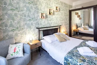 a bedroom with a bed and a couch and a chair at L12 Port window 1Bedroom Wifi 5mins beach & Nice's Cap in Nice