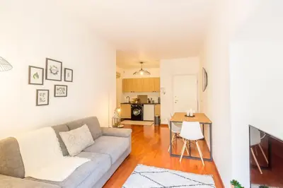 a living room with a couch and a table at L13 Central flat 5mins walk to beach AC/Balcon/WIFI in Nice