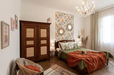 a bedroom with a bed and a chandelier at L14 2P Promenade Vue Mer climatisé, spacieux/ Balcon in Nice