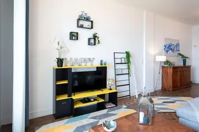 a living room with a flat screen tv at L14 2P Promenade Vue Mer climatisé, spacieux/ Balcon in Nice