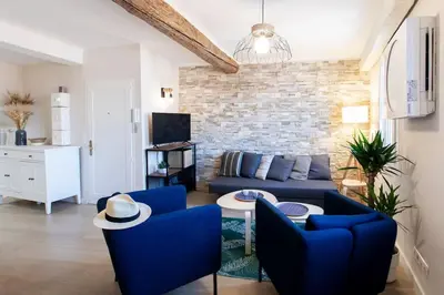 a living room with blue chairs and a blue couch at L16 Suite Malonat Vieux Nice 1 min Mer/ 2 chbres & AC in Nice