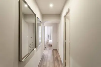 a hallway with a large mirror on the wall at L19 1BDR Massena central 2mins Sea/PromenadeAC/Balcony in Nice