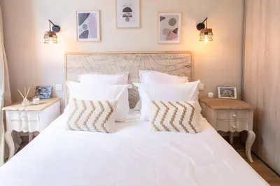 a bedroom with a white bed with white sheets and pillows at L19 1BDR Massena central 2mins Sea/PromenadeAC/Balcony in Nice