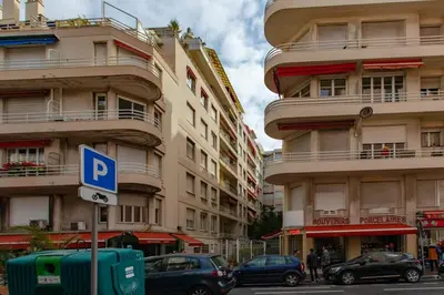a street with cars parked in front of tall buildings at L24 Meyerbeer Promenade 1min SEA & Negresco AC/Balcony in Nice